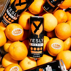 Yesly Energy Orange Cream glass pour illustrating refreshingly fizzy drink for workouts