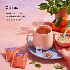 Steam rising from Yogi Sweet Tangerine Positive Energy Tea highlighting citrus fragrance.