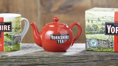 Yorkshire Tea red pillow tea bags in cup for infusion.