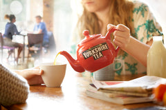 Yorkshire Tea bag with string tag ready for hot or iced tea.