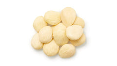 Yupik Marcona almonds skinless close-up reveals buttery texture and pale color.