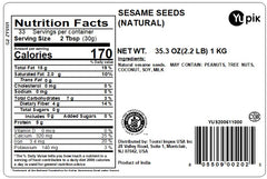 Pouring Yupik sesame seeds highlights crisp texture for salads and bowls.