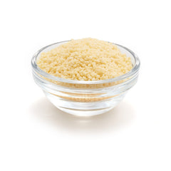 Yupik Organic Couscous steaming in a pot, absorbing flavors
