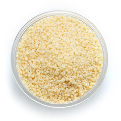Yupik Organic Couscous dry granules in a measuring cup