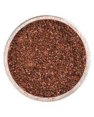 ZAATAR DIP Sumac Spice being sprinkled on greens for vibrant flavor.