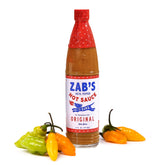Zab's Datil peppers bottle shows vibrant color and sweet heat for flavorful meals.