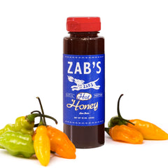 Zab's Hot Honey bottle side view signaling premium packaging and slow burn