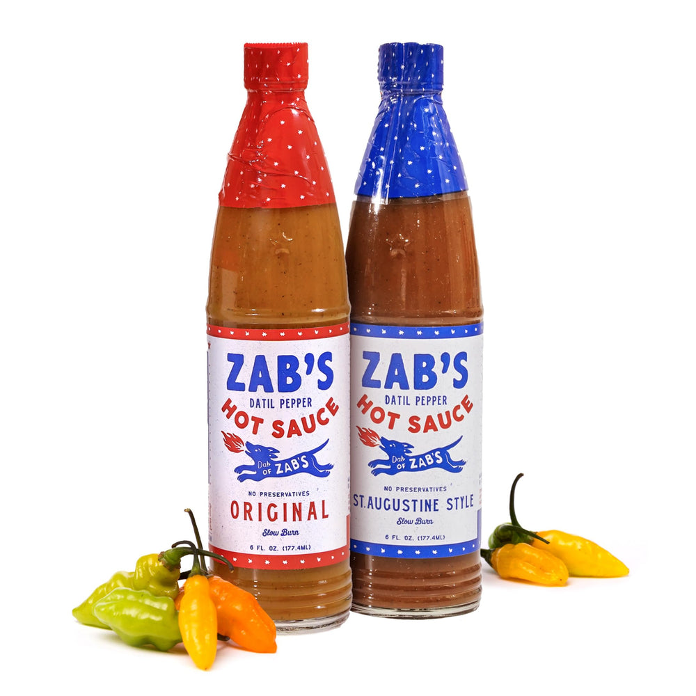 Zab's Original hot sauce bottle pour adds layered heat to eggs and meats.