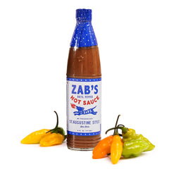 Zab's St. Augustine hot sauce bottle showcases Datil peppers, ideal for pizza and wings.