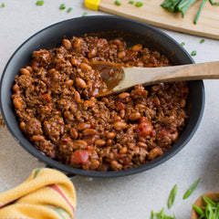 Zatarain's Red Bean Seasoning close-up on raw beans and meat ready to simmer