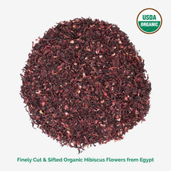 Zeeza hibiscus tea brew in a glass, rich red infusion for cooling drinks