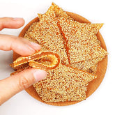 zhai-ji-di HelenOu666 soft-sticky sesame candy on plate for sharing