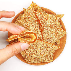 zhai-ji-di HelenOu666 soft-sticky sesame candy on plate for sharing