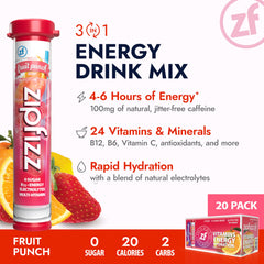 Opened Zipfizz Fruit Punch tube beside a glass of water ready to mix.
