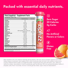 Zipfizz pink grapefruit glass with prepared drink boosts hydration on the go.