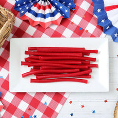 Office candy bowls featuring RedVinnes licorice ropes for quick snacking.