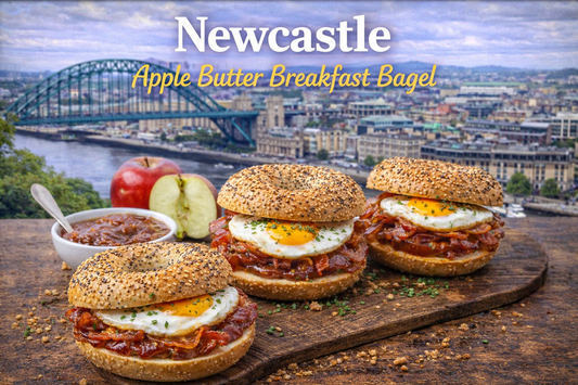 A warm open-faced Newcastle Apple Butter Breakfast Bagel topped with quick apple butter, maple almond butter, chopped walnuts and served with breakfast tea, styled for the BoroPantry UK blog.