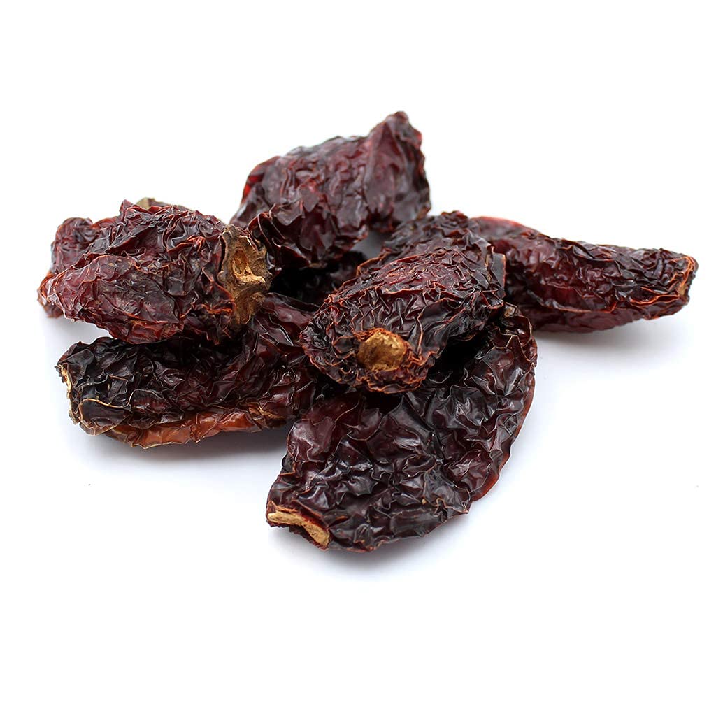 Close up of smoky Morita chipotle peppers highlighting rich color and chocolatey aroma.