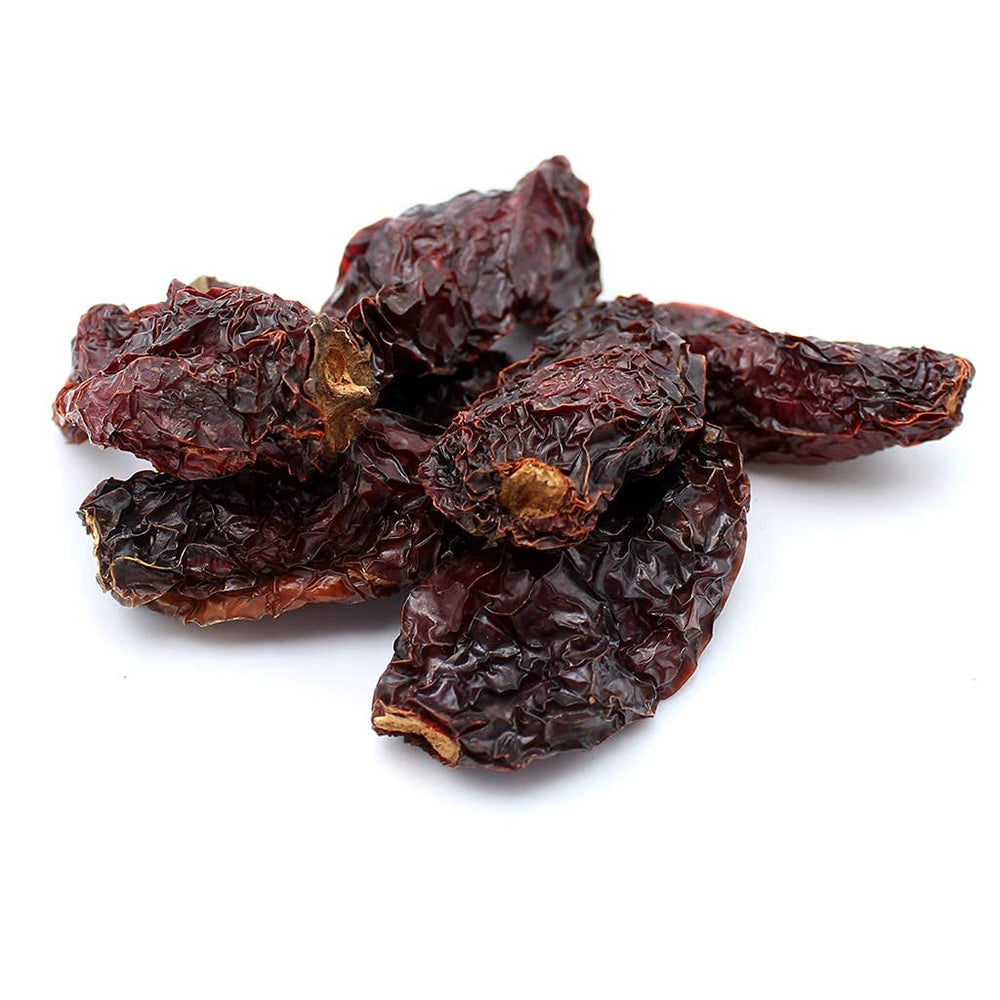 Close up of smoky Morita chipotle peppers highlighting rich color and chocolatey aroma.