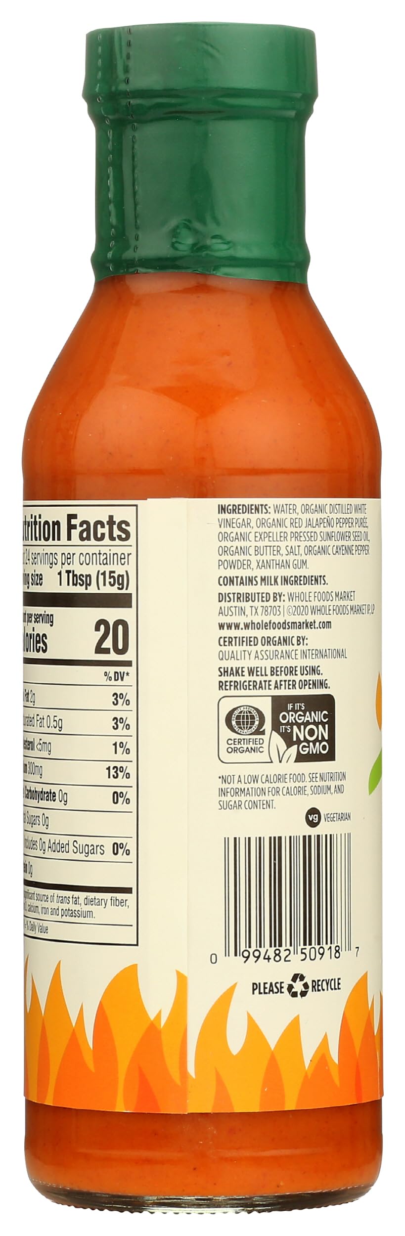 Organic buffalo wing sauce bottle close-up with bold branding.