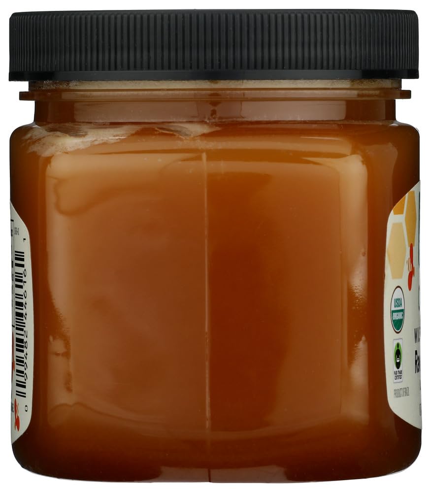 365 by Whole Foods Market 16-ounce honey on rustic wooden table.
