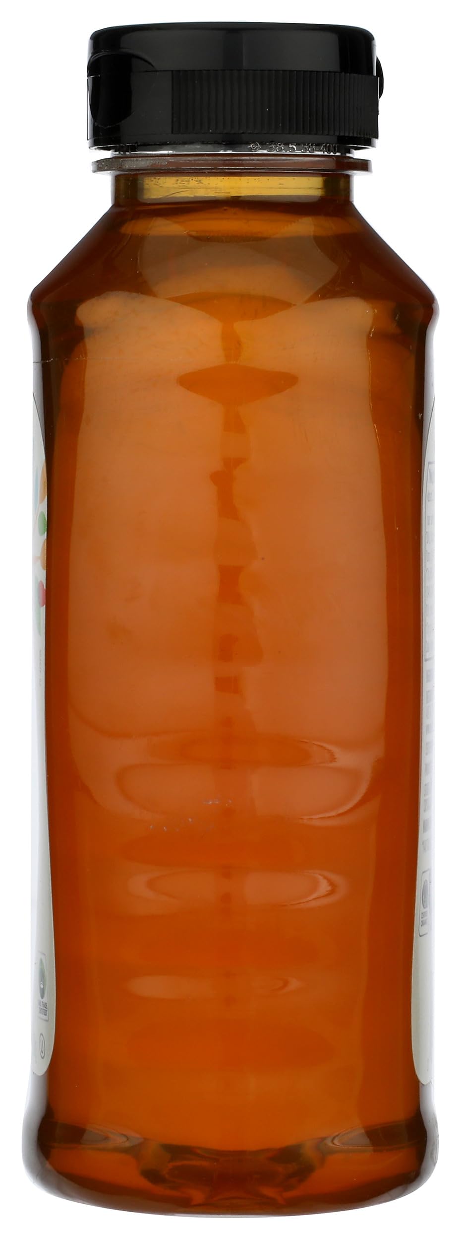 Close-up pour of 365 by Whole Foods Market honey showing delicate amber color