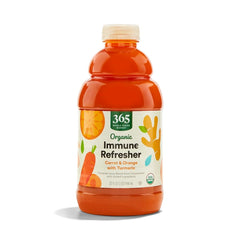 365 by Whole Foods Market organic carrot orange turmeric juice bottle on counter, ideal for daily refreshment