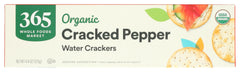 365 by Whole Foods Market Organic Cracked Pepper crackers on a cheese board for easy pairing.