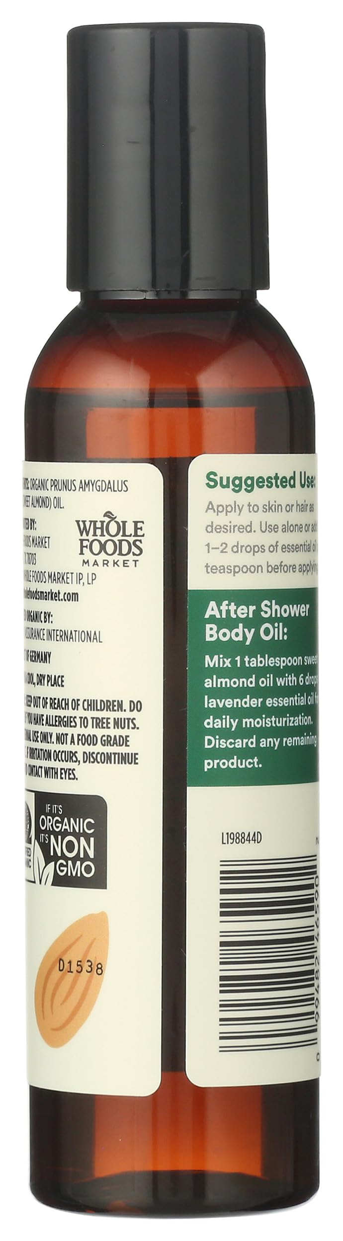 Close-up of the almond oil bottle with pour cap showing premium quality.