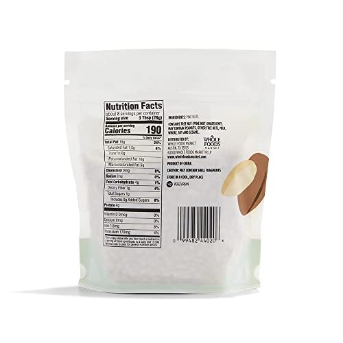Close-up of 365 by Whole Foods Market pine nuts, perfect for enriching sauces and toppings.