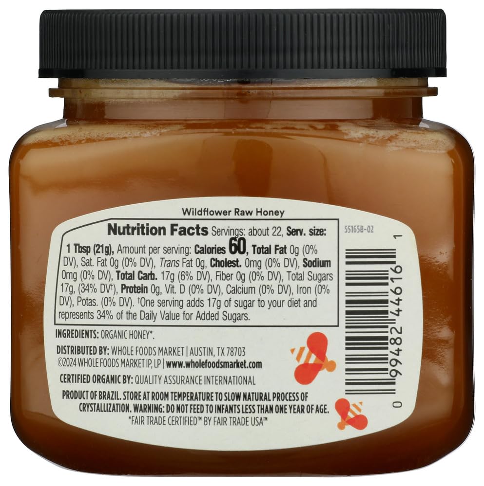 365 by Whole Foods Market raw honey close-up with drizzle for tea and sweetening.