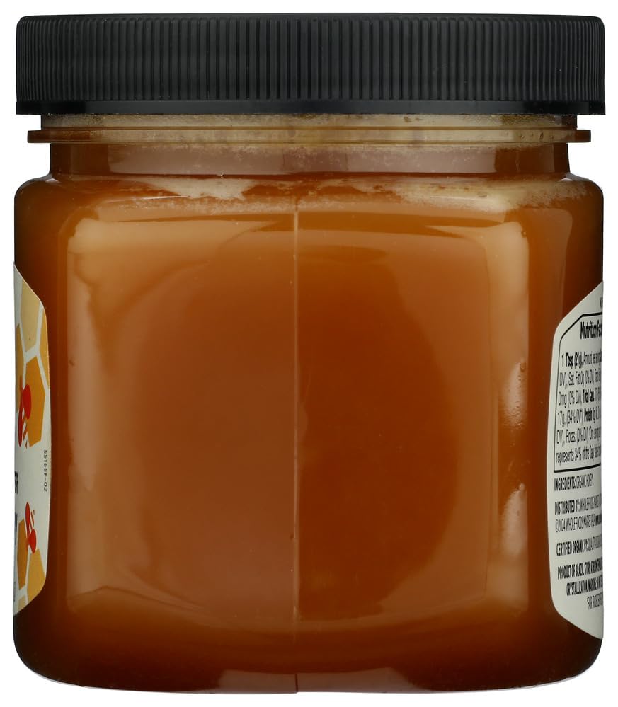365 by Whole Foods Market raw wildflower honey in dessert setting.