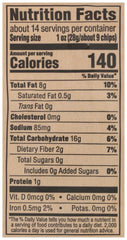Close-up of 365 by Whole Foods Market stone-ground white corn tortilla chips showing light texture