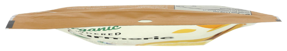 Scoop of 365 turmeric powder ready to blend into beverages.