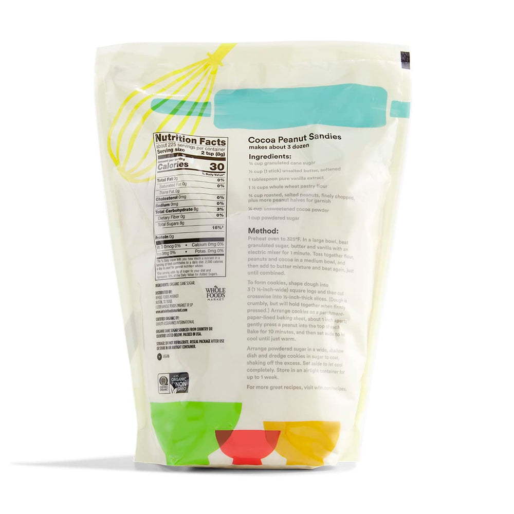 Pouring 365 by Whole Foods Market Organic Cane Sugar into a bowl for even browning in recipes.