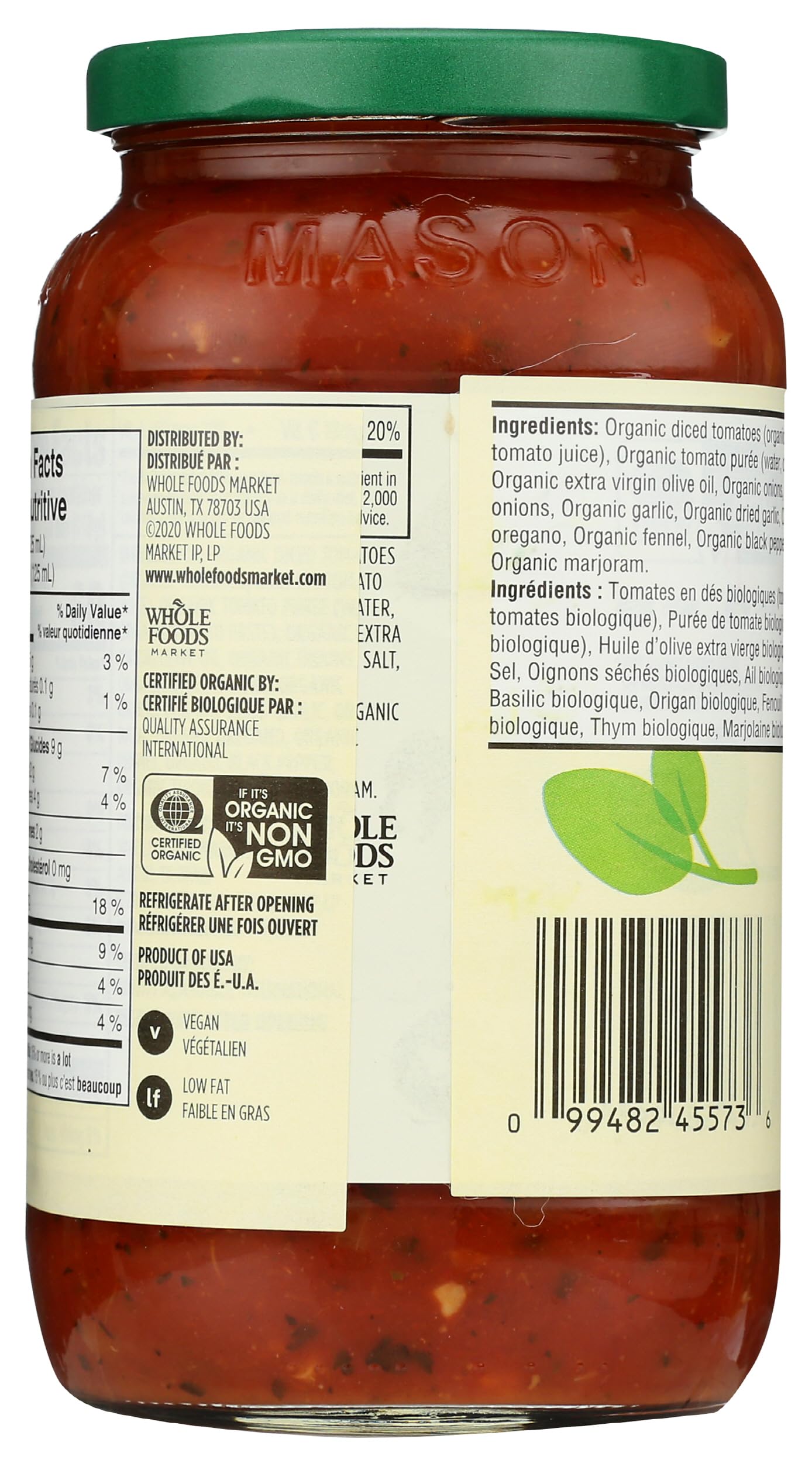 Pouring 365 by Whole Foods Market Organic Italian Herb Pasta Sauce over pasta.