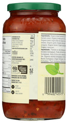 Pouring 365 by Whole Foods Market Organic Italian Herb Pasta Sauce over pasta.