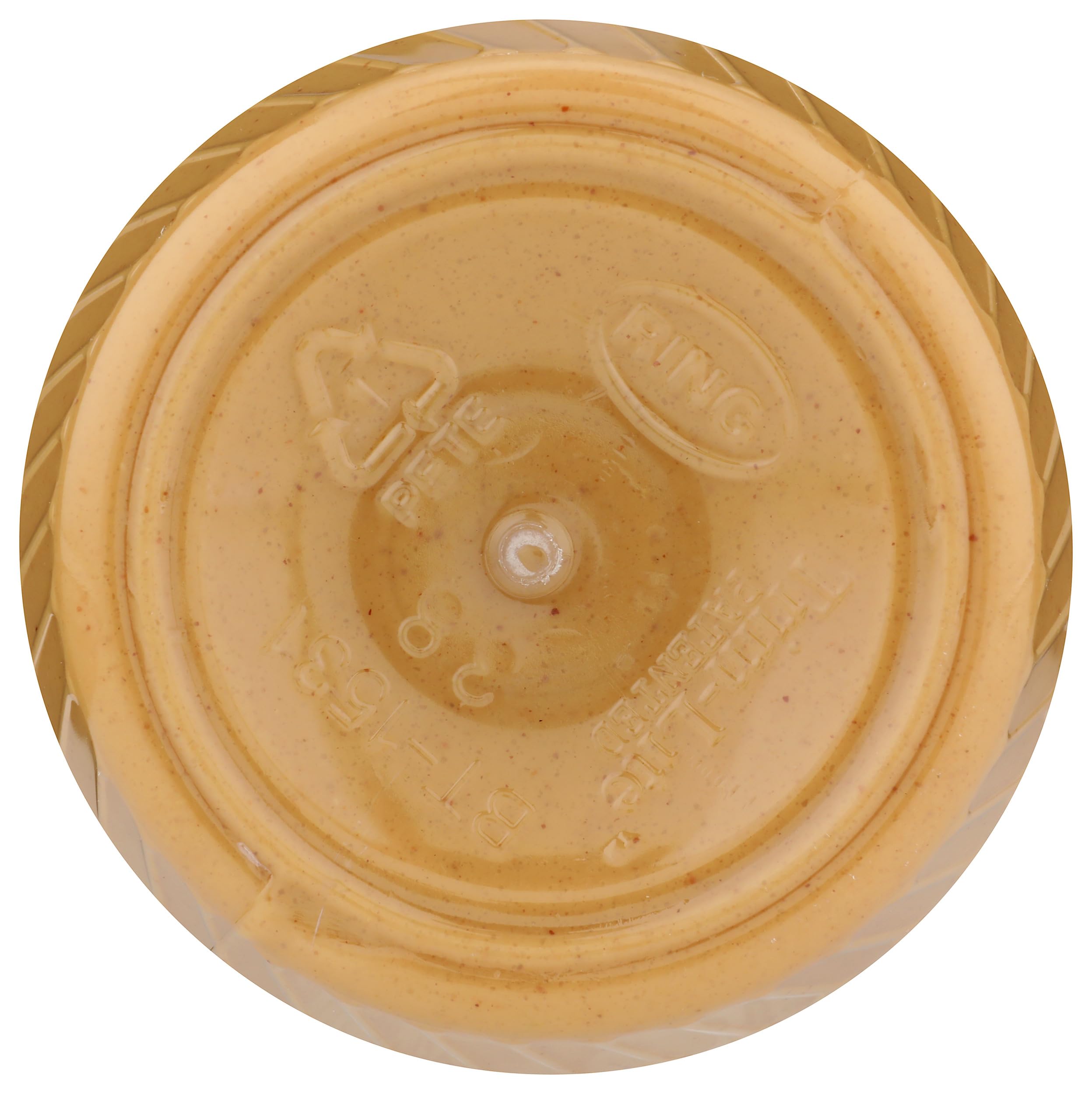 Scoop of creamy peanut butter spread showcasing smooth texture