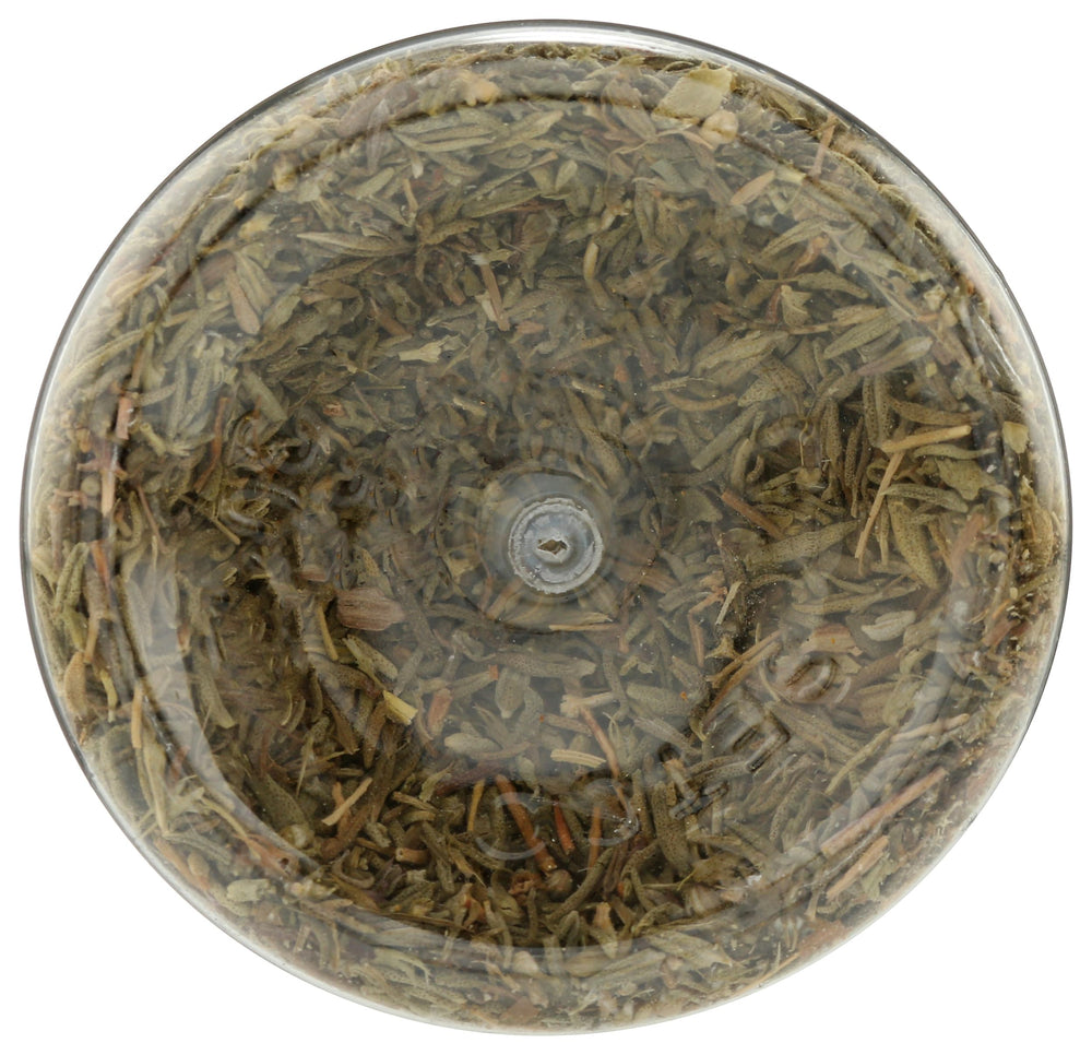 365 thyme bottle pouring aroma into a dish to enhance flavor
