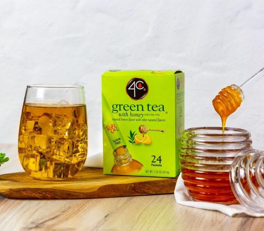 4C green tea powder drink stix stirred into a glass for refreshing taste