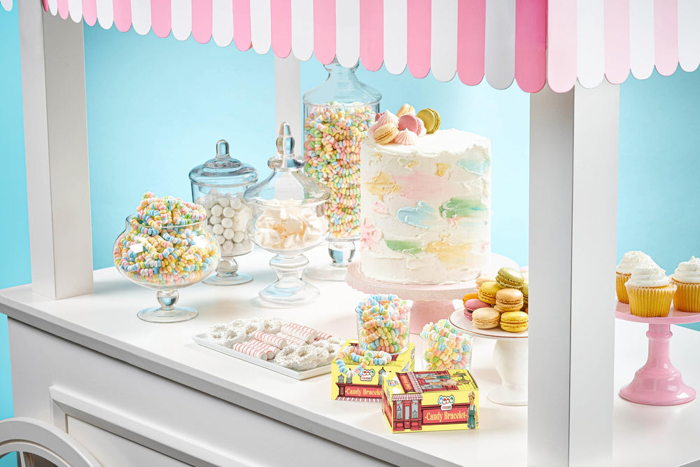 4YoreElves pastel candy buffet display featuring bright bracelets as edible decor.