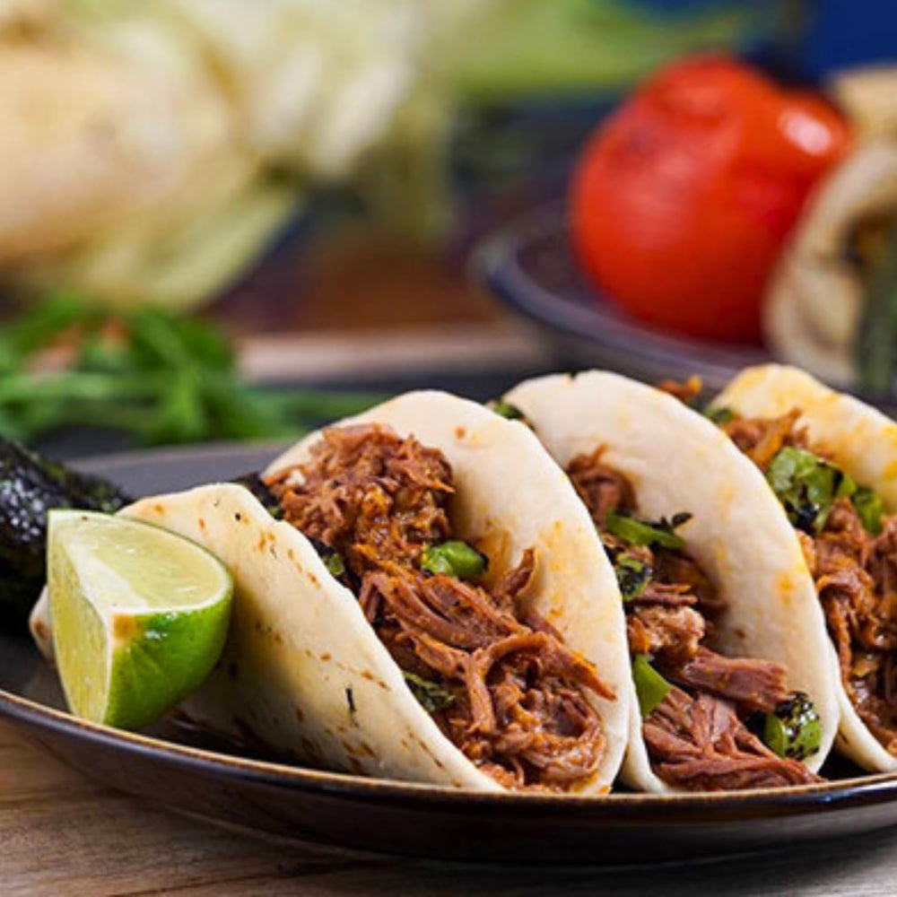 505 Southwestern Medium Green Chile Sauce serving pour highlights versatility for bowls and tacos