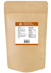 52USA Ground cinnamon pour closeup showing smooth texture and warmth
