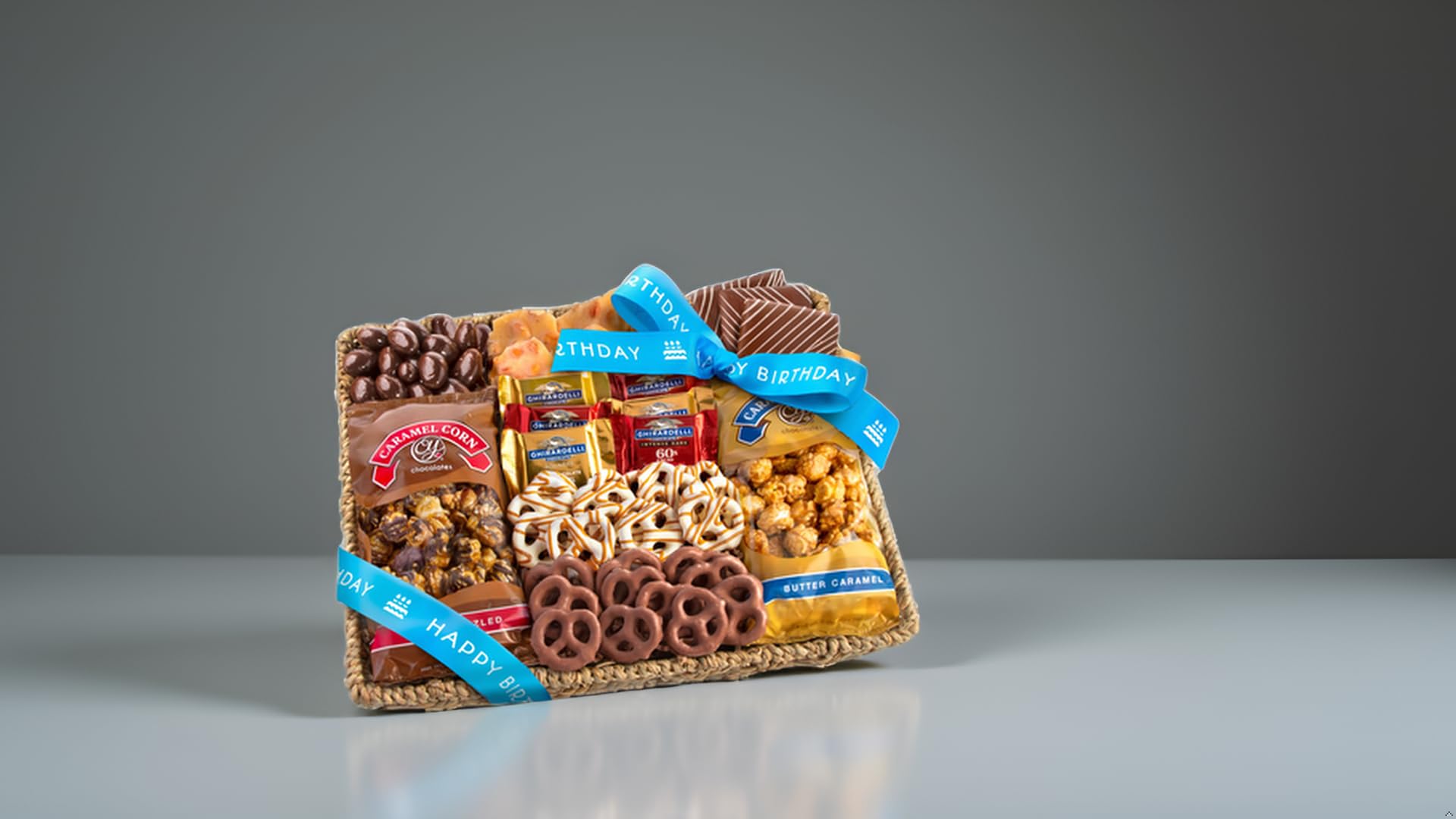 A Gift Inside birthday chocolate caramel corn closeup, showcasing gooey caramel and chocolate drizzle.