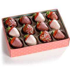 A Gift Inside chocolate drizzles strawberries illustrate festive chocolate detail.