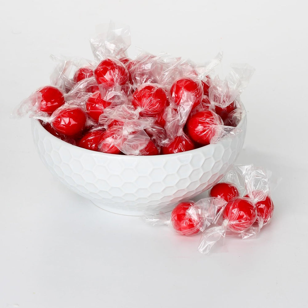 Candy bowl display featuring A Great Surprise cinnamon balls for desk-friendly treats