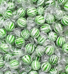 A Great Surprise candy buffet setup with mint balls and greens