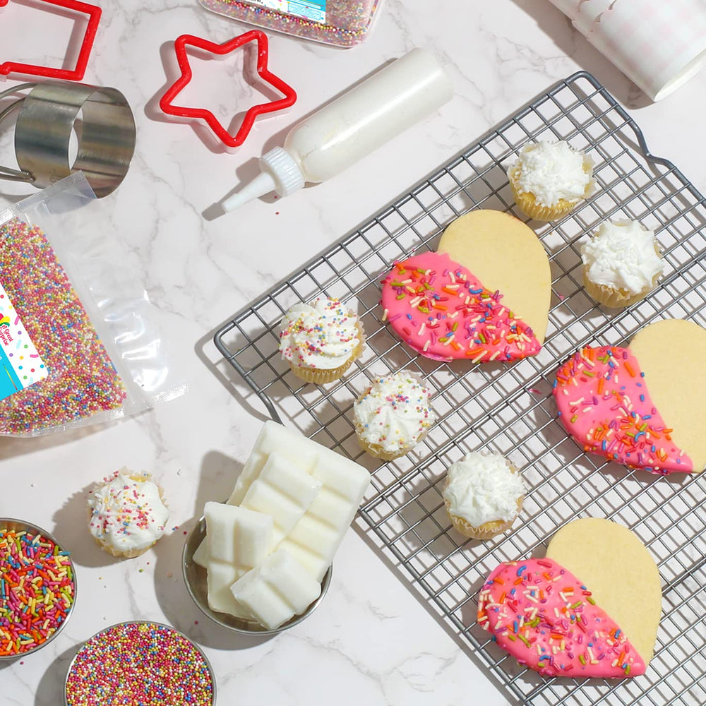 A Great Surprise sprinkles scattered on cake and cupcakes for decoration