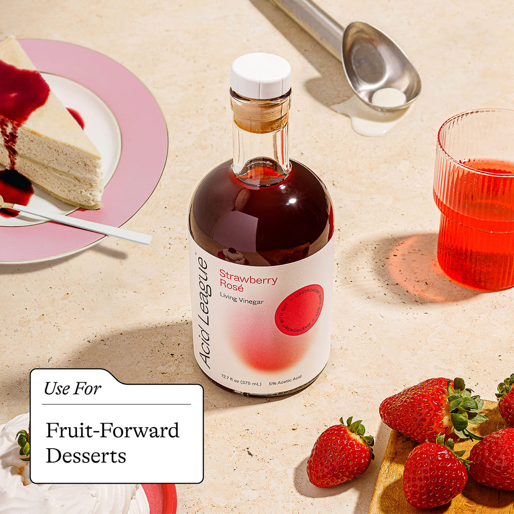 Glass of yogurt with Acid League Strawberry Rosé Living Vinegar drizzle.