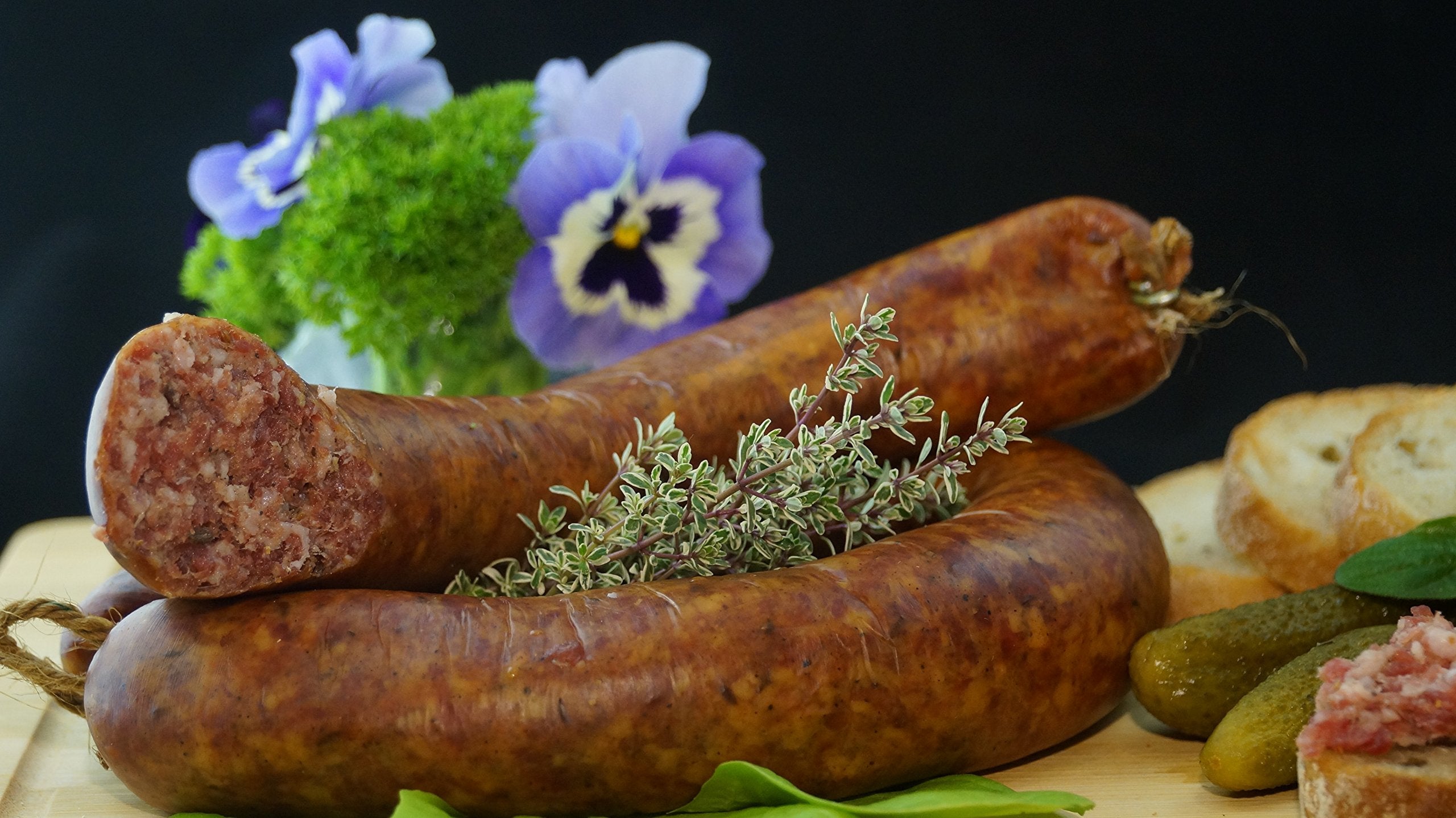 Kitchen counter with Adkins bag and spices for sausage night.